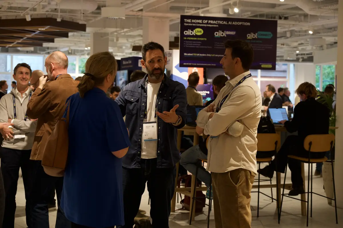 Business leaders talking in the networking area at aiblLIVE 2026