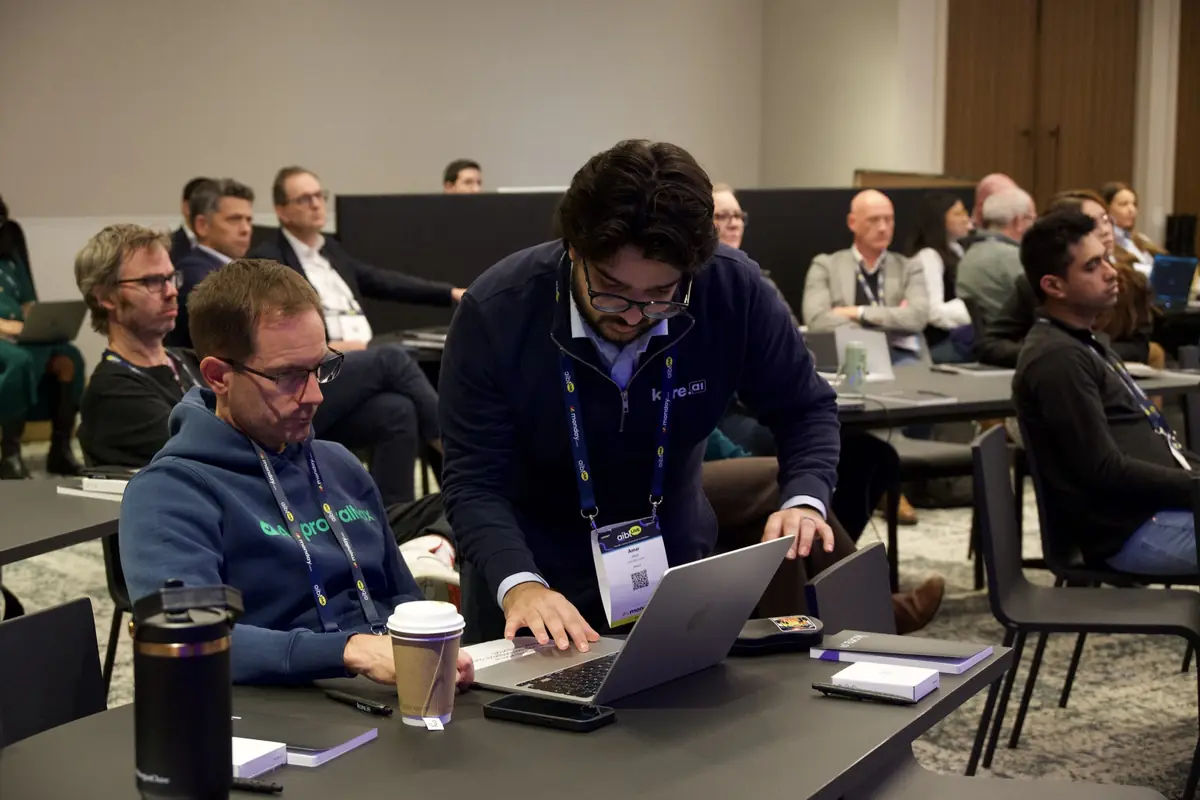 Leaders building on laptops during a hands-on workshop at aiblLIVE 2026