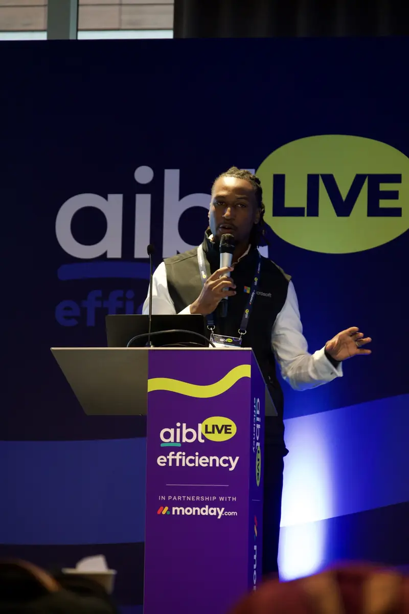 A speaker on the Efficiency track stage